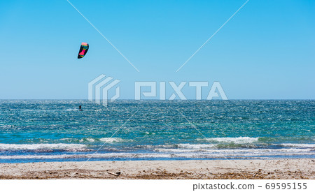 Kite surfing on a clear day 69595155