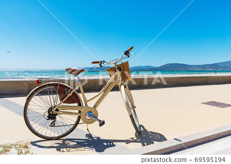 Vintage bicycle by Alghero shore 69595194