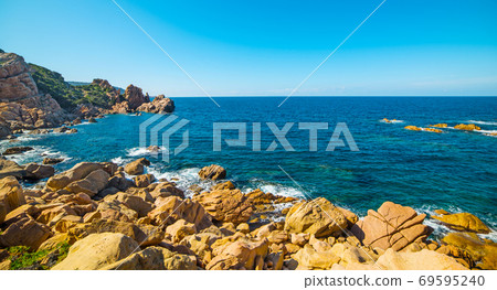 Blue water and rocky cove 69595240