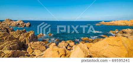Clear sky over a rocky coast 69595241