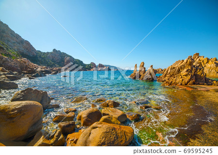 rocks and blue sea in costa paradiso. Sardinia, Italy rocks and blue sea in costa paradiso. Sardinia, Italy 69595245
