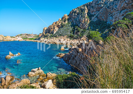 Rocky cove and blue water Rocky cove and blue water 69595417