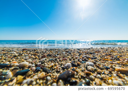 Sun shining over Perdepera beach Sun shining over Perdepera beach 69595670