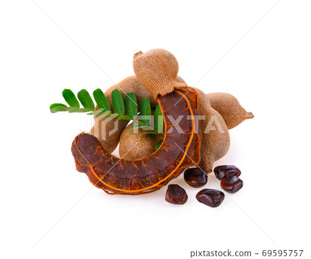 Fresh tamarind fruits with leaves on white background 69595757