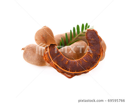 Fresh tamarind fruits with leaves on white background 69595766