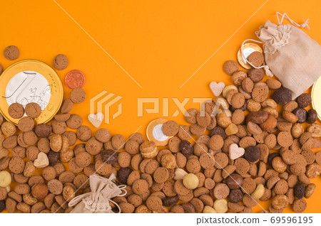 St. Nicholas Day background. Card. Dutch holiday Sinterklaas flat lay with gifts, pepernoten St. Nicholas Day background. Card. Dutch holiday Sinterklaas flat lay with gifts, pepernoten 69596195