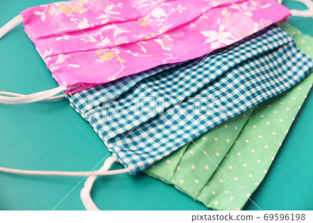 homemade face masks on color background close up homemade face masks on color background close up 69596198