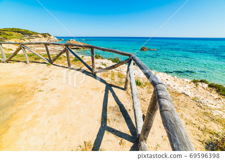 Wooden fence in Santa Giusta beach Wooden fence in Santa Giusta beach 69596398