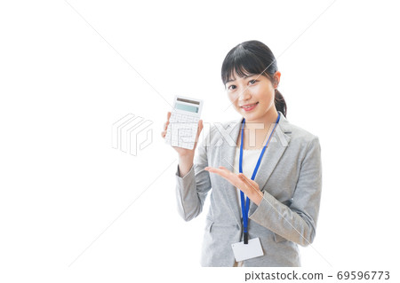 Young business person with a calculator Young business person with a calculator 69596773