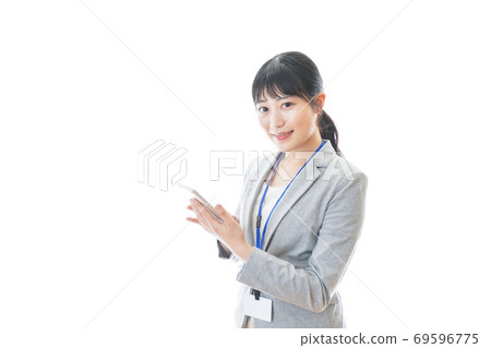 Young business person with a calculator Young business person with a calculator 69596775