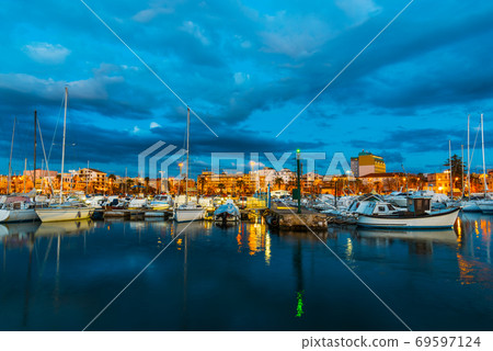 Boats in Alghero harbor at night 69597124