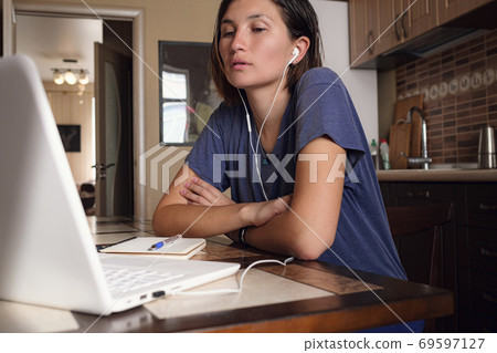 Asian Woman freelancer lecture and working on laptop at home. Asian Woman freelancer lecture and working on laptop at home. 69597127