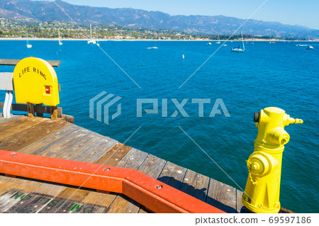 Yellow hydrant in Santa Barbara pier 69597186