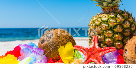 Summer fruits on a tropical beach 69598283