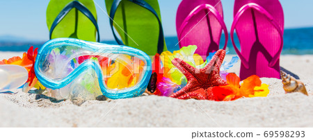 Scuba mask and colorful flip flops 69598293