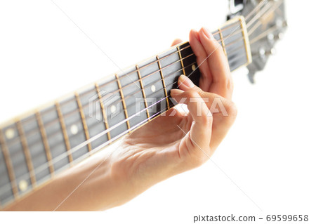 Close up of guitarist hand playing guitar, copyspace, macro shot 69599658