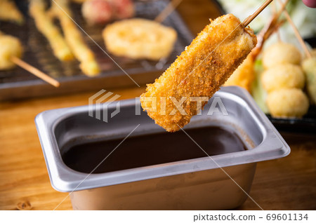 Kushikatsu or Kushiage, japanese Osaka style deep fried skewers Kushikatsu or Kushiage, japanese Osaka style deep fried skewers 69601134