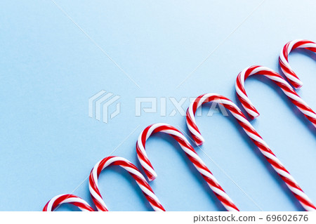 Christmas candy canes and fir branches flat lay Christmas candy canes and fir branches flat lay 69602676