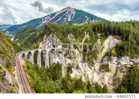 Mountain landscape with Landwasser Viaduct, Filisur, Switzerland. Mountain landscape with Landwasser Viaduct, Filisur, Switzerland. 69603571