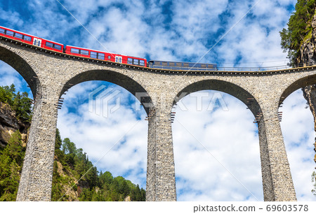 Train runs on Landwasser Viaduct, Filisur, Switzerland. Train runs on Landwasser Viaduct, Filisur, Switzerland. 69603578