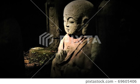 Jizo is one on a dark background. 69605406