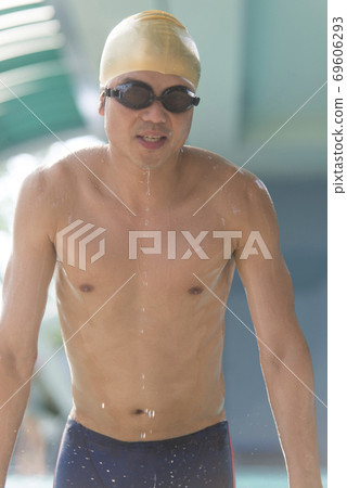 Man rising from the pool 69606293