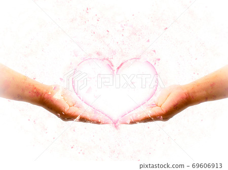 Support the pink heart shape with two hands Support the pink heart shape with two hands 69606913