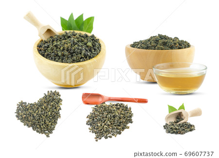 Dry green oolong tea in wooden bowl an isolated on white background with clipping path Dry green oolong tea in wooden bowl an isolated on white background with clipping path 69607737