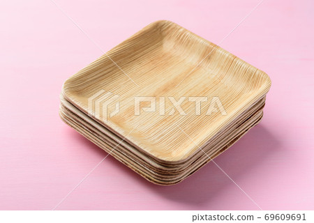 Betel palm leaf plate (Biodegradable plate) on pink background Betel palm leaf plate (Biodegradable plate) on pink background 69609691