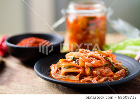 Kimchi cabbage with ingredients on wooden table, Korean food Kimchi cabbage with ingredients on wooden table, Korean food 69609712