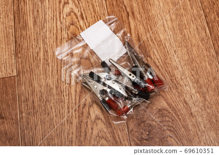 Engineering probes in package on wooden table 69610351