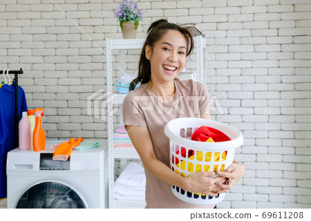 Housewife doing laundry 69611208