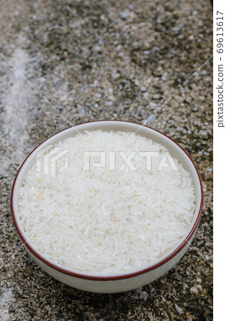 Uncooked Rice in Ceramic Bowl. Uncooked Rice in Ceramic Bowl. 69613617