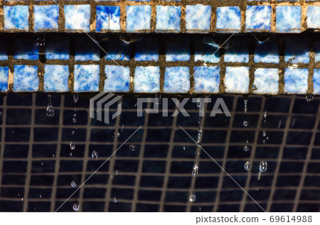 falling water drops from wall with vintage tiles falling water drops from wall with vintage tiles 69614988