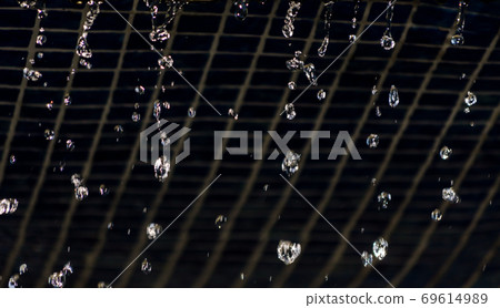 falling water drops from wall with vintage tiles 69614989