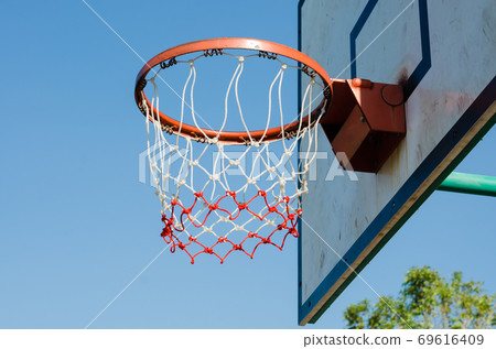 The Basketball Hoop is Outdoor. 69616409