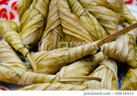 Sweet Sticky Rice (or "Khao Tom Luk Yon" in Thai name) is a Traditional Thai Dessert. 69616413