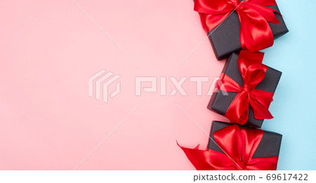 Black friday sale flat lay with gift box and ribbon, copy space, christmas and holidays concept on pink blue background Black friday sale flat lay with gift box and ribbon, copy space, christmas and holidays concept on pink blue background 69617422