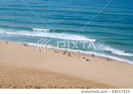 Tottori Sand Dunes People playing at the beach Tottori Sand Dunes People playing at the beach 69617428