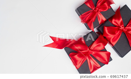 Black friday sale flat lay with gift box and ribbon, copy space, christmas and holidays concept on white background 69617437