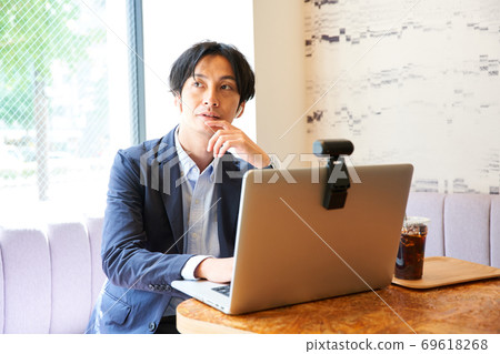 Cafe rental office A man doing desk work 69618268