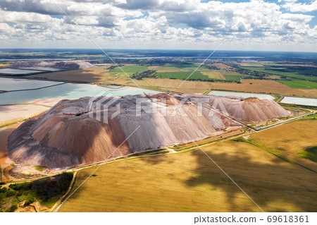 Mountains of products for the production of potash salt and artificial reservoirs.Salt mountains near the city of Soligorsk.Production of fertilizers for the Land. Belarus. 69618361