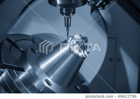 The 5 axis CNC milling machine cutting the turbine. The 5 axis CNC milling machine cutting the turbine. 69622786