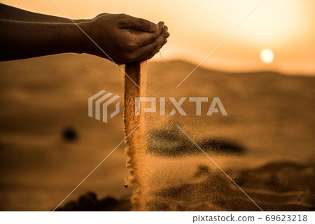 Sahara desert sunset and falling sand 69623218