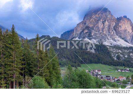 Beautiful evening view of the Sassongher mountain peak covered with clouds 69623527