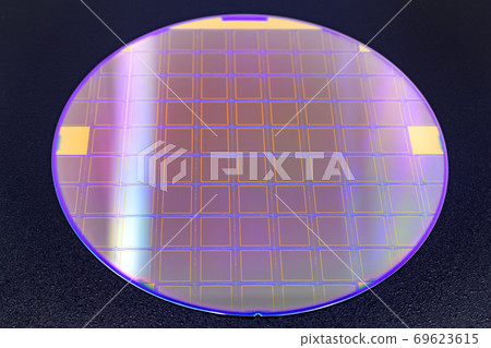 Silicon wafer with microchips on black background. 69623615