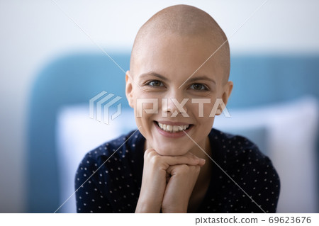 Portrait of smiling hairless woman cancer fighter Portrait of smiling hairless woman cancer fighter 69623676