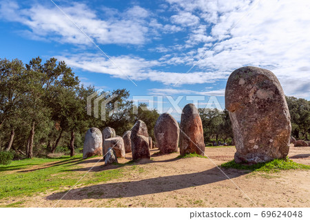 View of the megalithic complex Almendres Cromlech (Cromelelique dos Almendres) Evora View of the megalithic complex Almendres Cromlech (Cromelelique dos Almendres) Evora 69624048