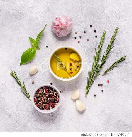 Herbs and condiments on light stone background. Herbs and condiments on light stone background. 69624074