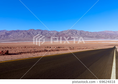 View of highway (Artists Dr.) crossing Death Valley National Park. California. USA 69624818